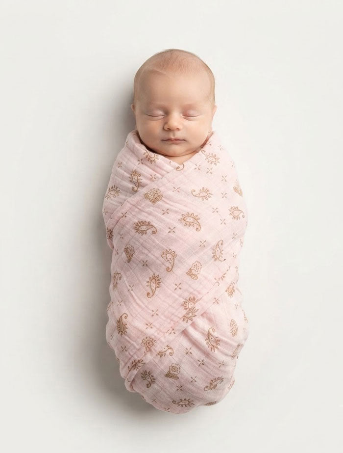 Pink printed organic cotton muslin swaddle