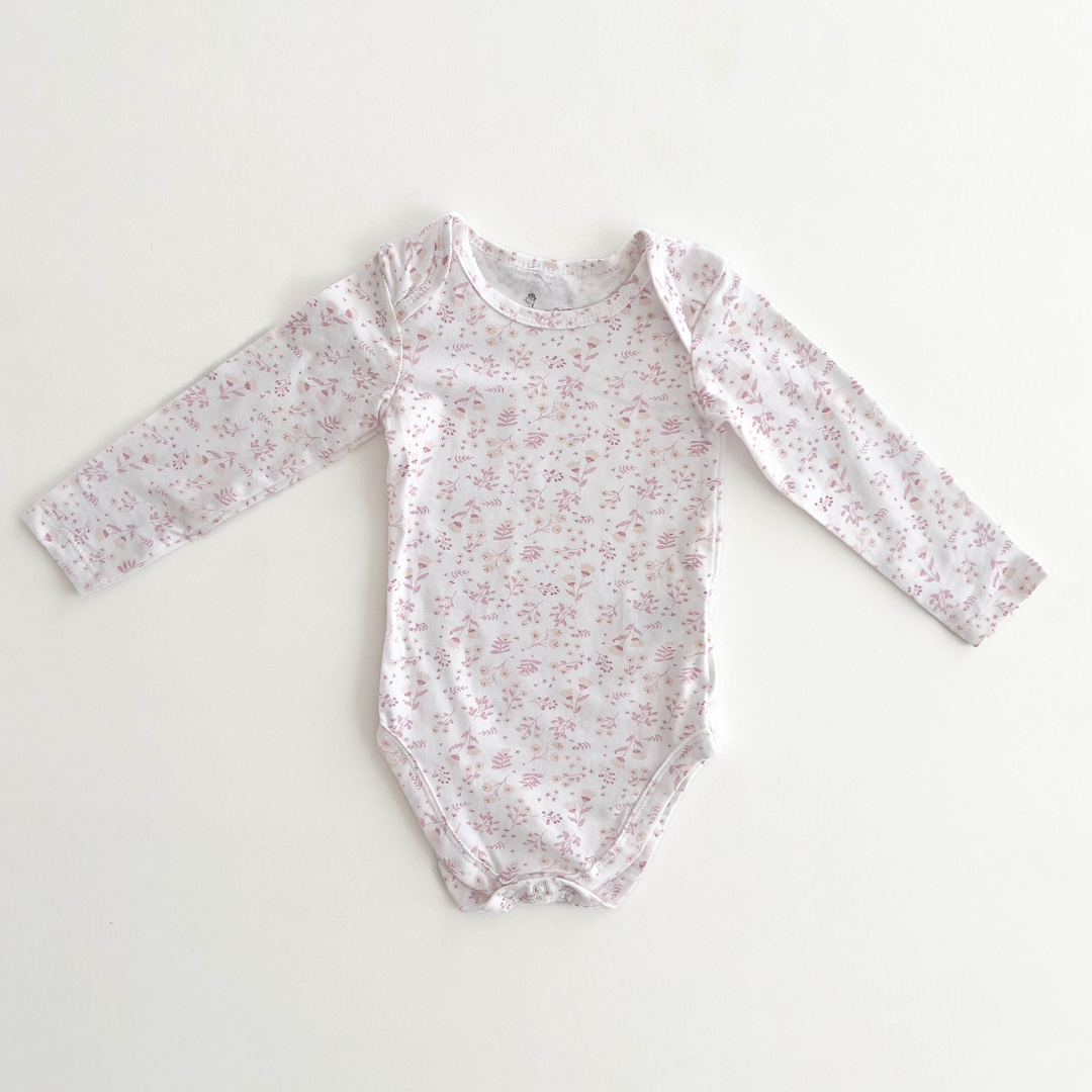 PINK FLORAL PATTERNED ONESIE