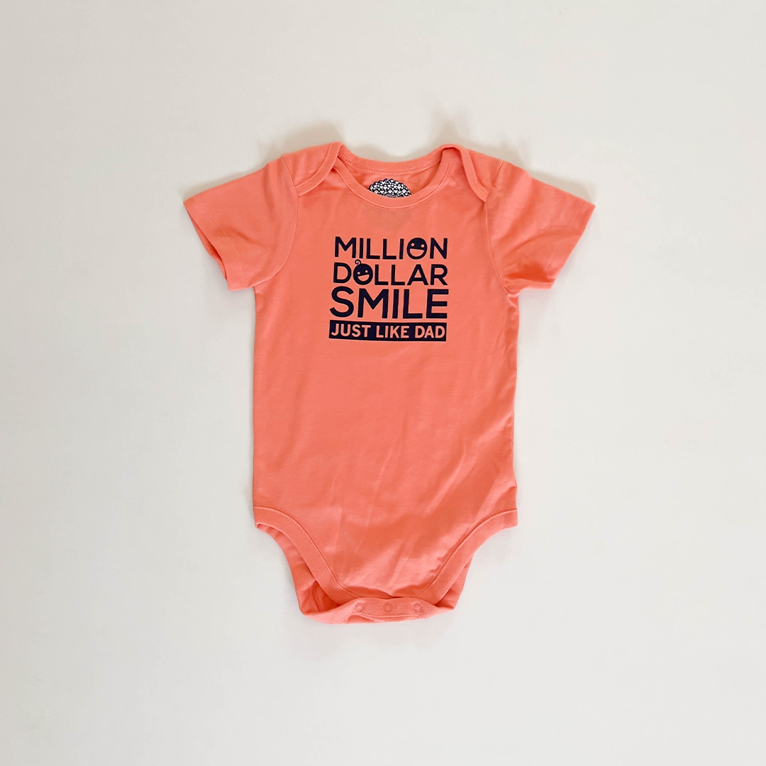 ORANGE PRINTED ONESIE