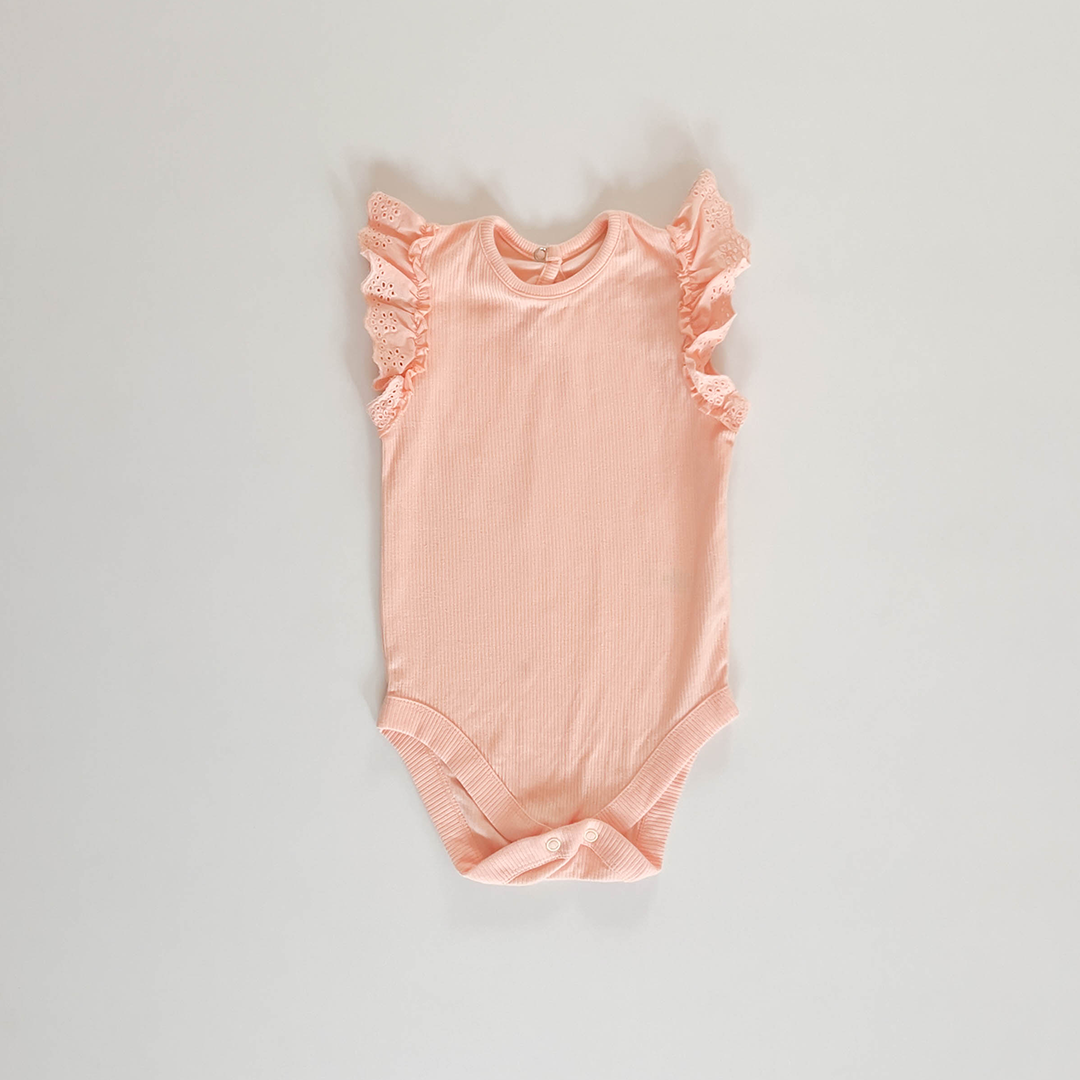 PEACH RIBBED ONESIE