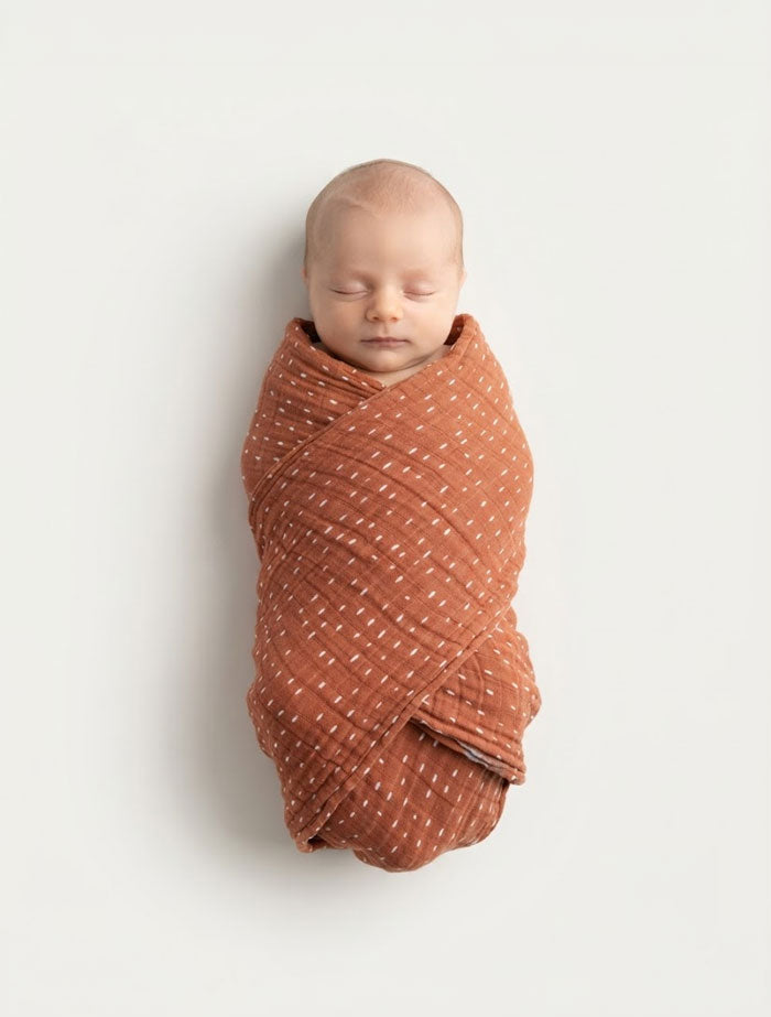 Brown patterned organic cotton muslin swaddle