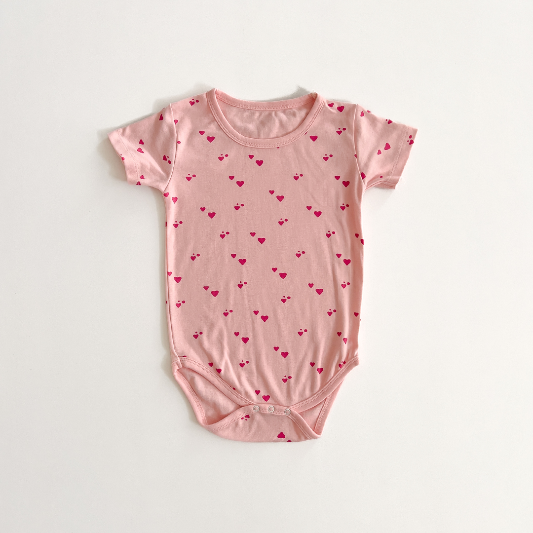 PINK LOVE PATTERNED ONESIE