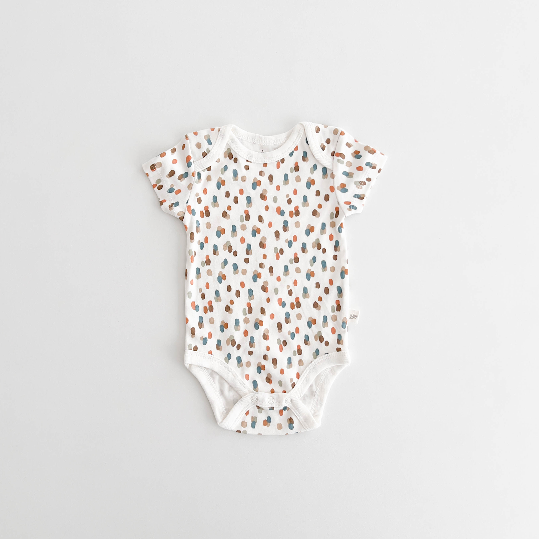 WHITE PATTERNED COTTON ONESIE