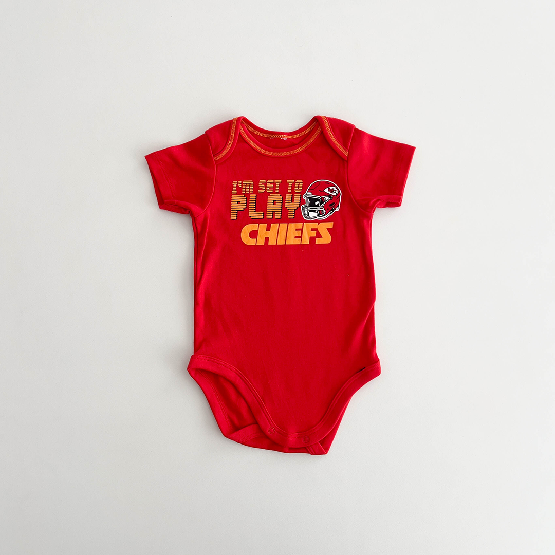 RED PRINTED COTTON ONESIE