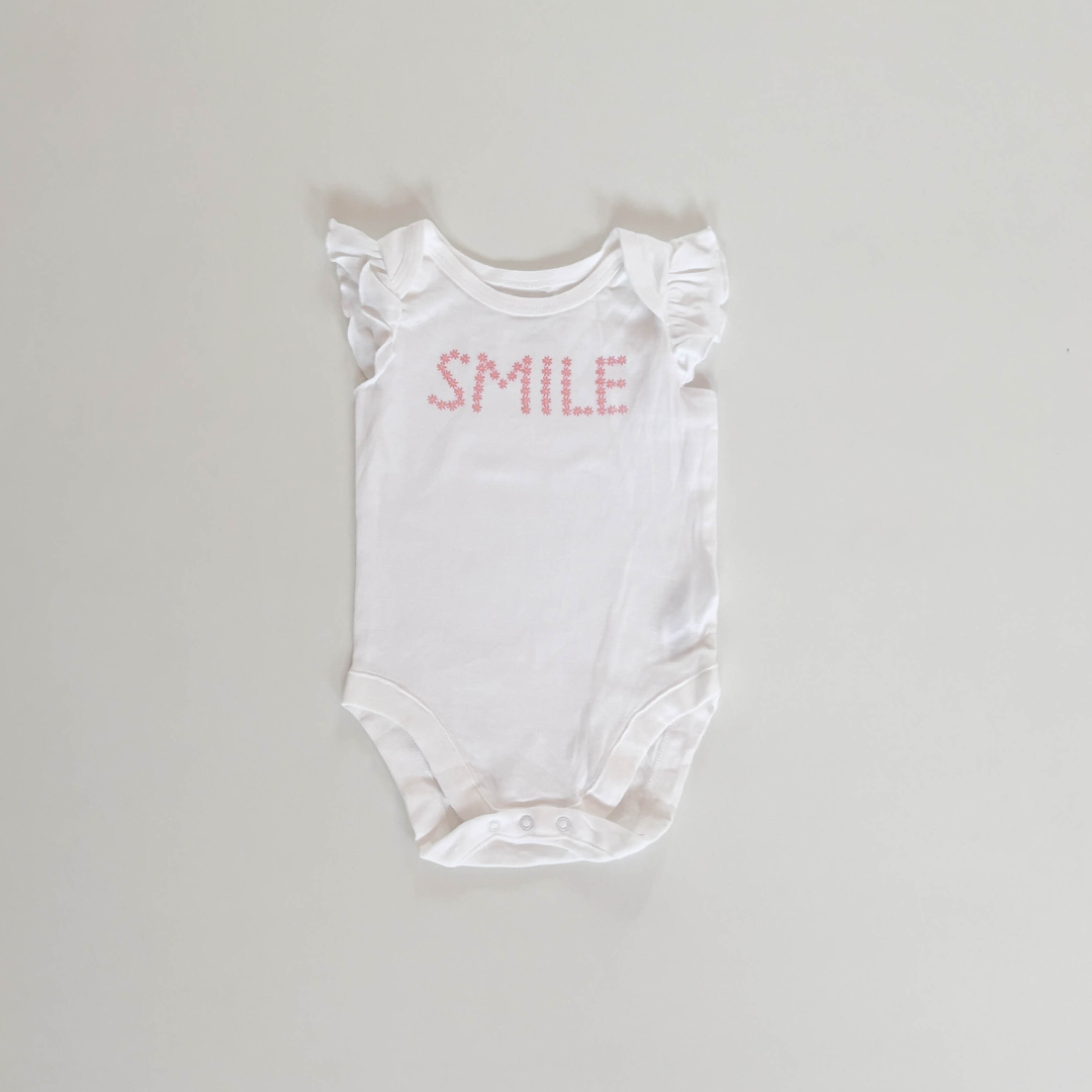 WHITE SMILE PRINT ONESIE