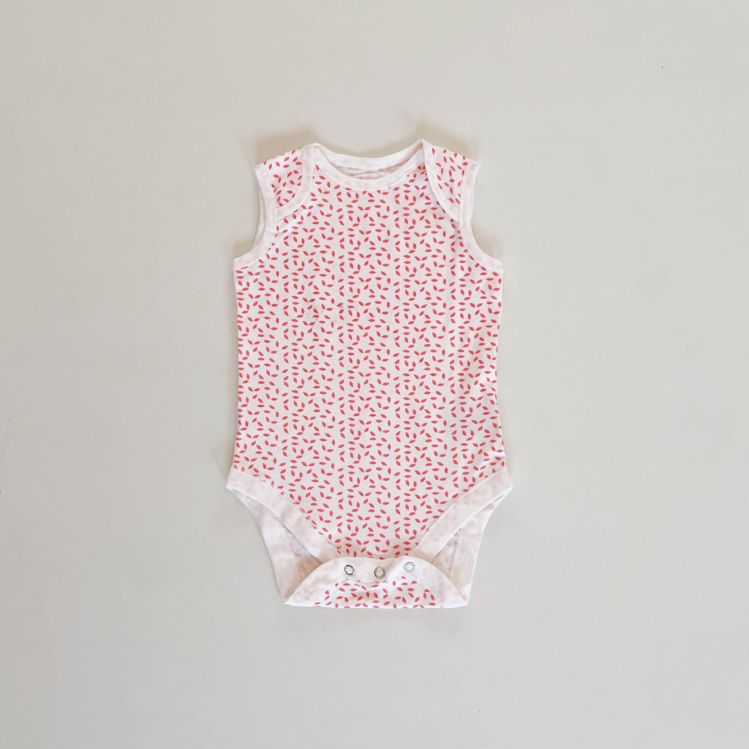 RED PATTERNED SLEEVLESS ONESIE