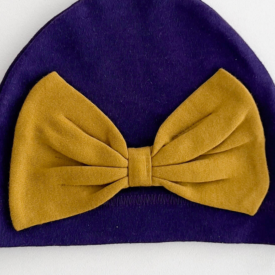 YELLOW BOW PURPLE CAP