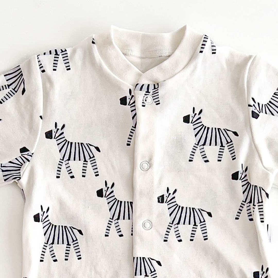 ZEBRA PRINTED WHITE SLEEPSUIT