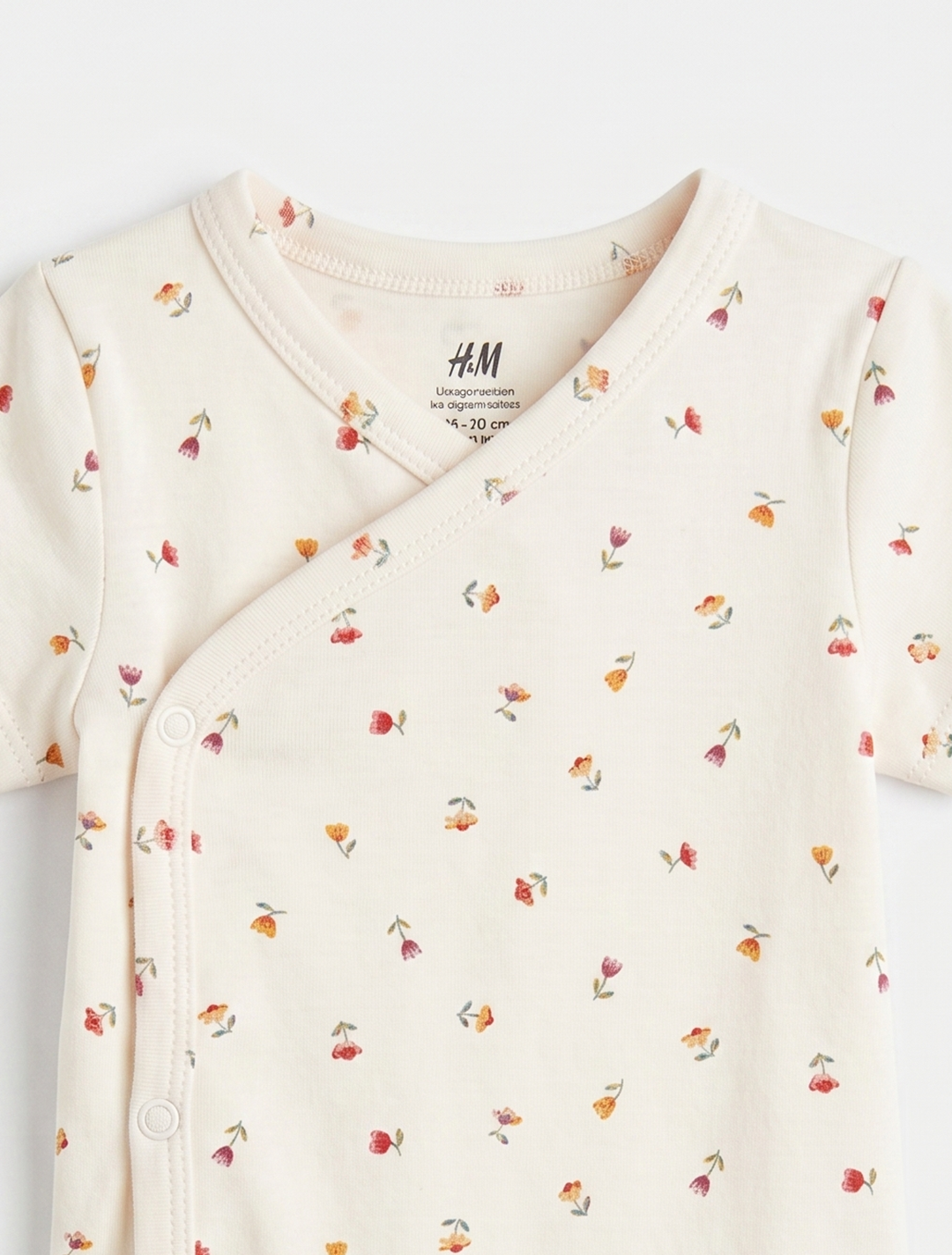 OFF WHITE WRAPOVER FLORAL ONESIE