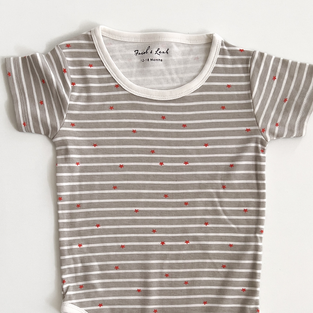 grey and white striped star print onesie