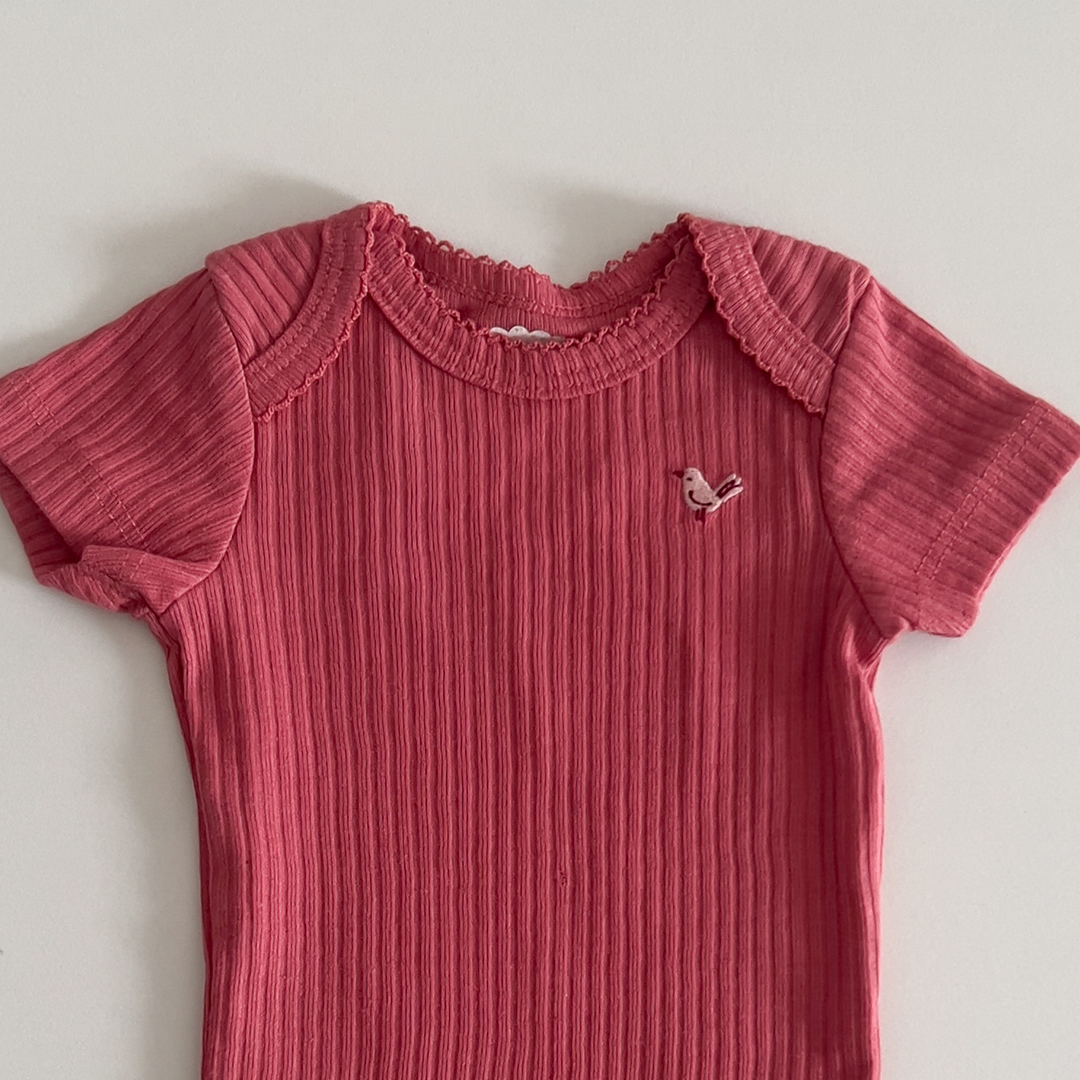 Coral pink ribbed onesie