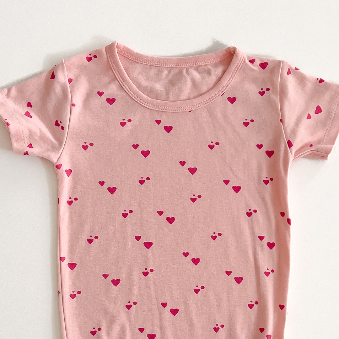 PINK LOVE PATTERNED ONESIE