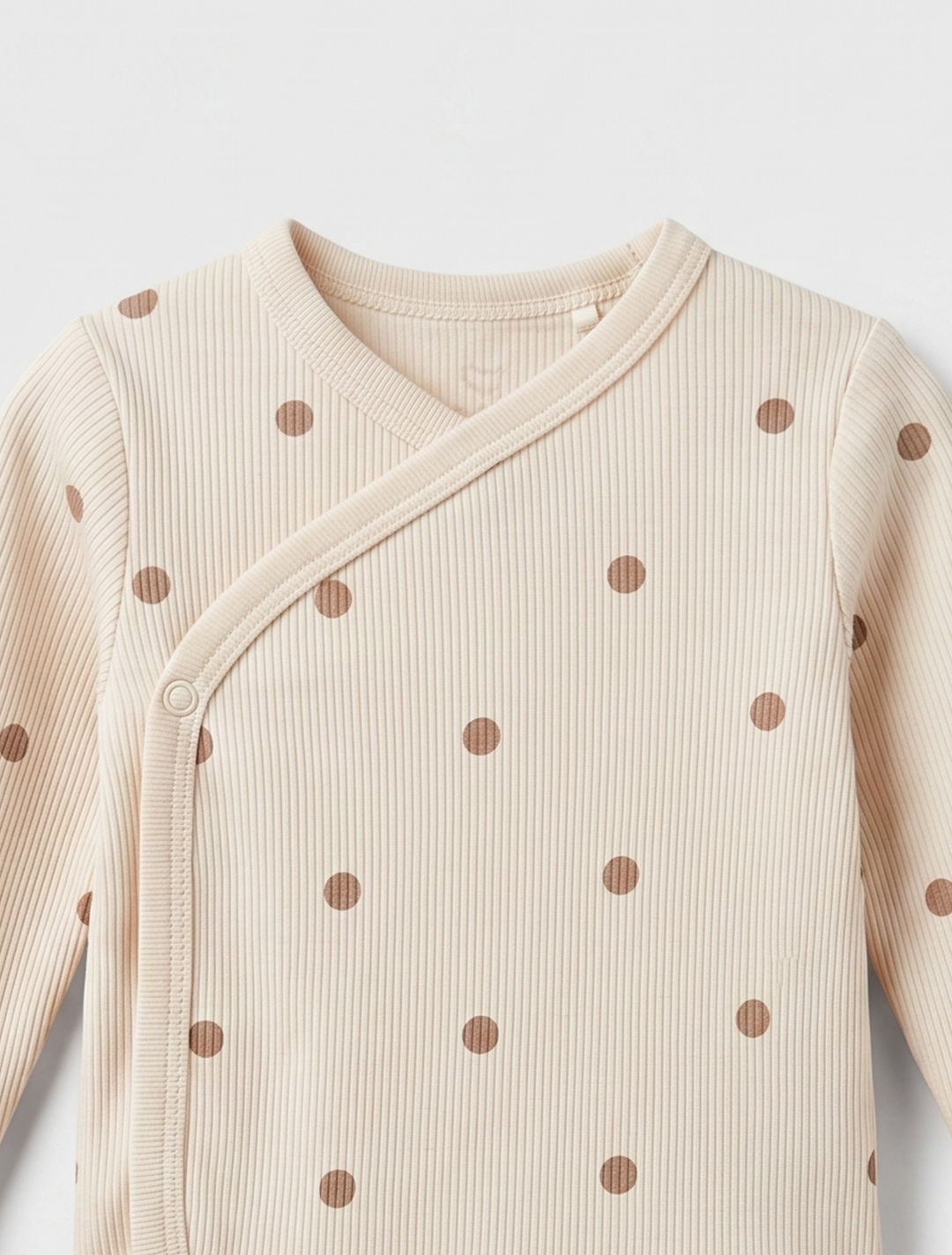 BEIGE POLKA DOTTED WRAPOVER ONESIE