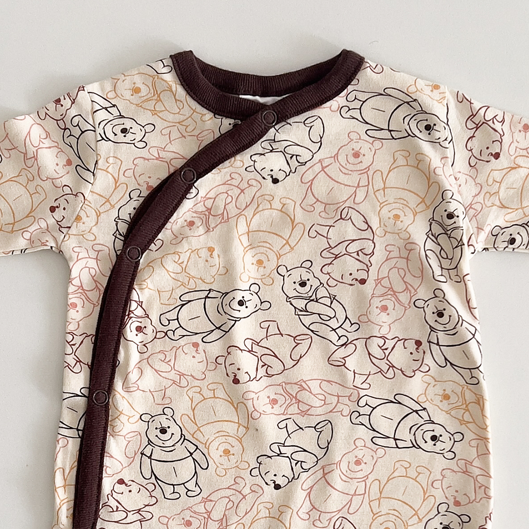 Beige and brown patterned sleepsuit