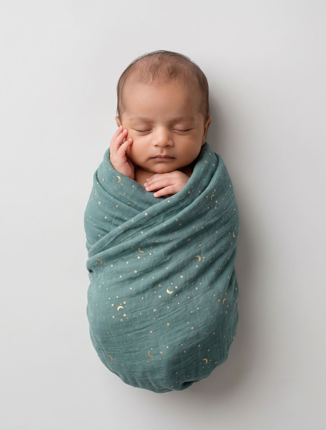 Dark green star printed muslin swaddle