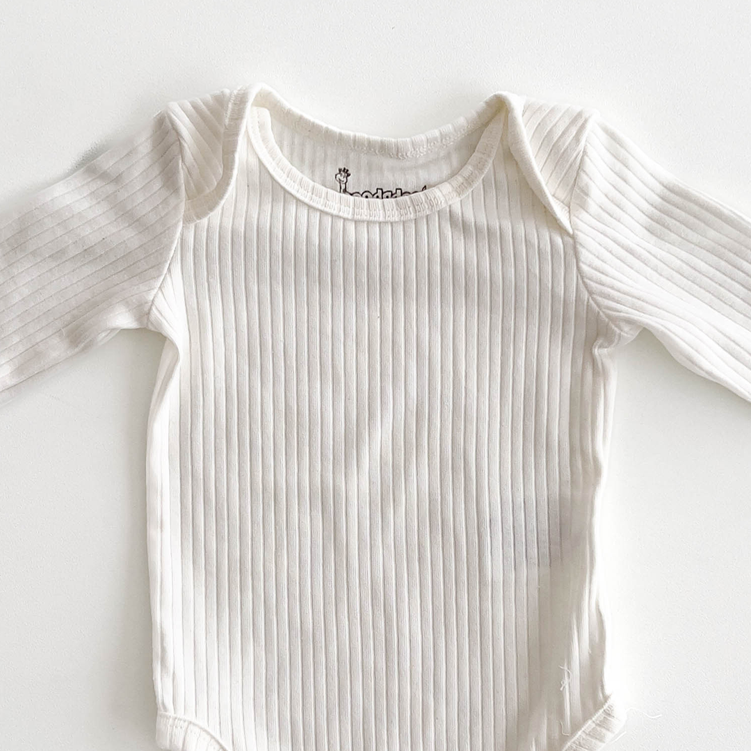 WHITE RIBBED COTTON ONESIE