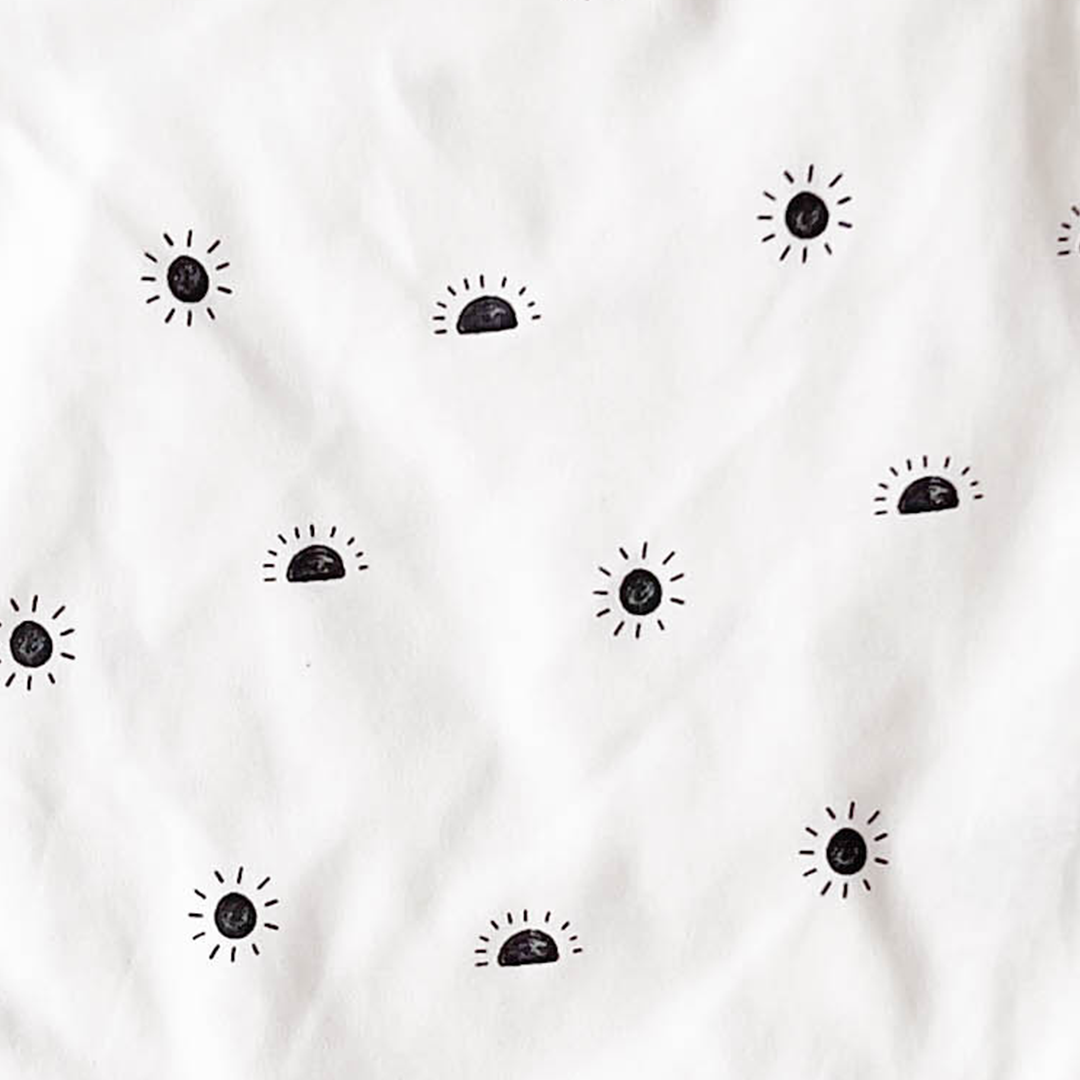 BLACK SUN PRINTED ONESIE