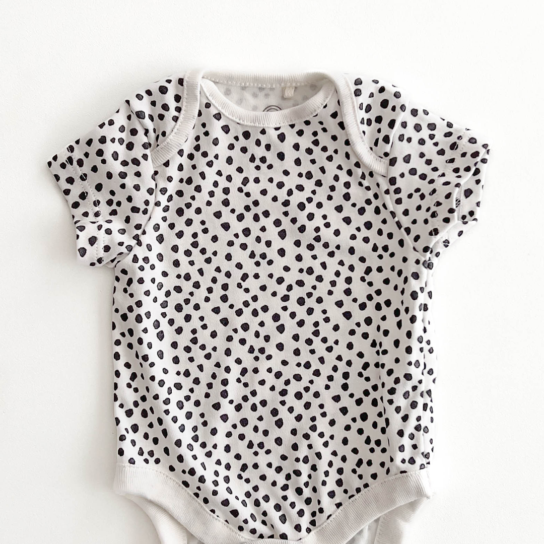 NEXT BABY BLACK AND WHITE PATTERNED ONESIE