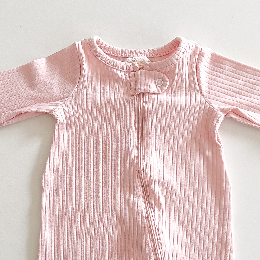 Pink ribbed sleepsuit