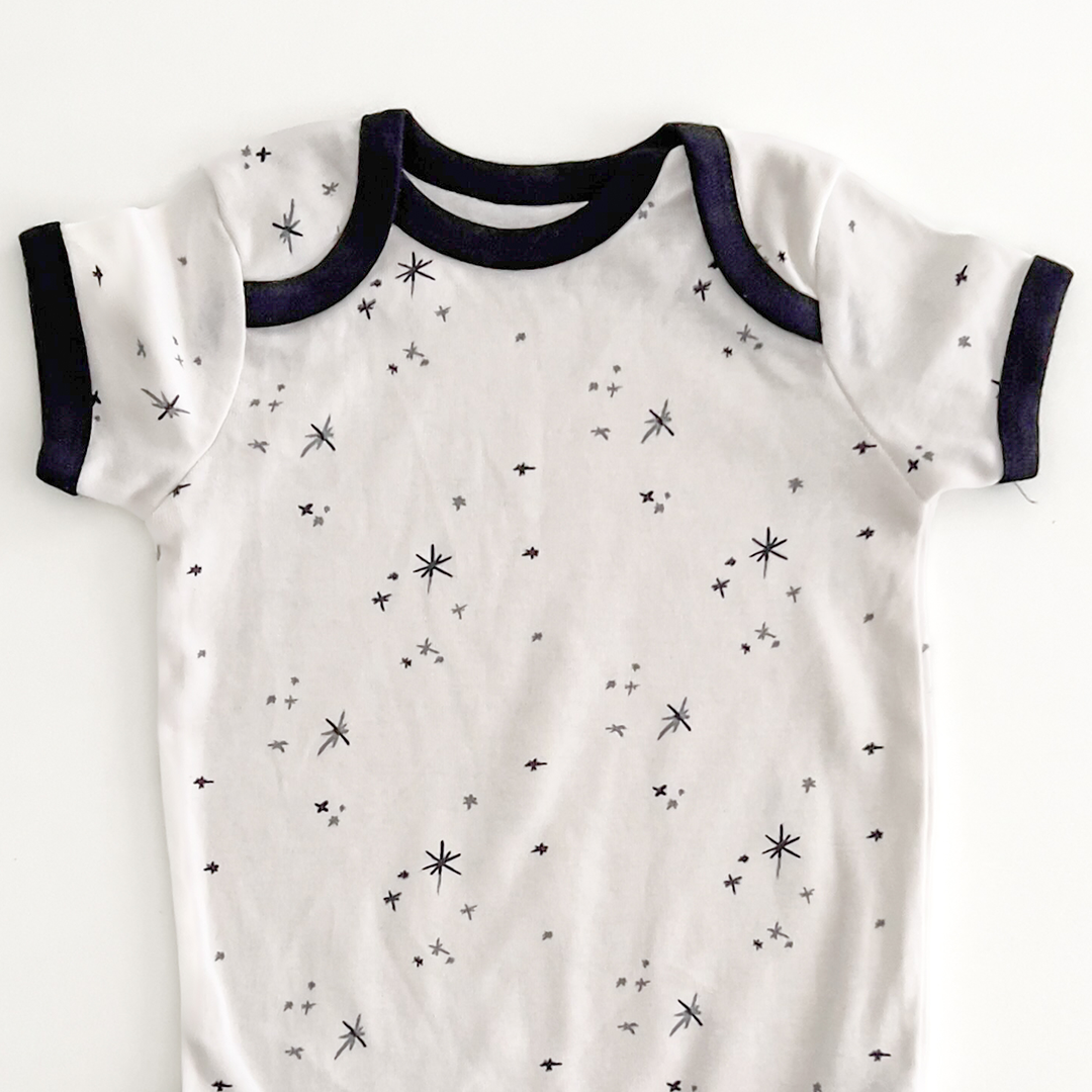 NAVY BLUE STAR PRINT ONESIE