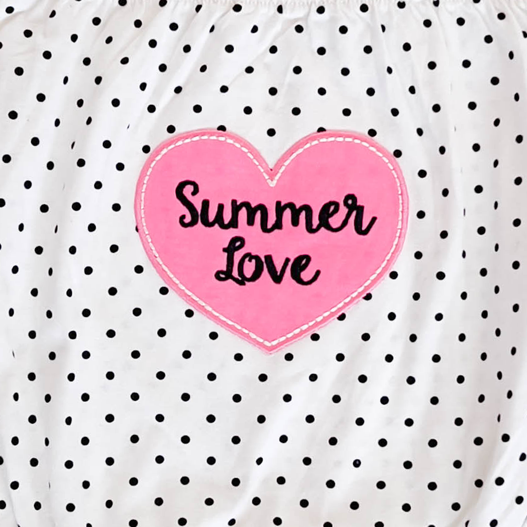 BLACK POLKA DOTTED ONESIE