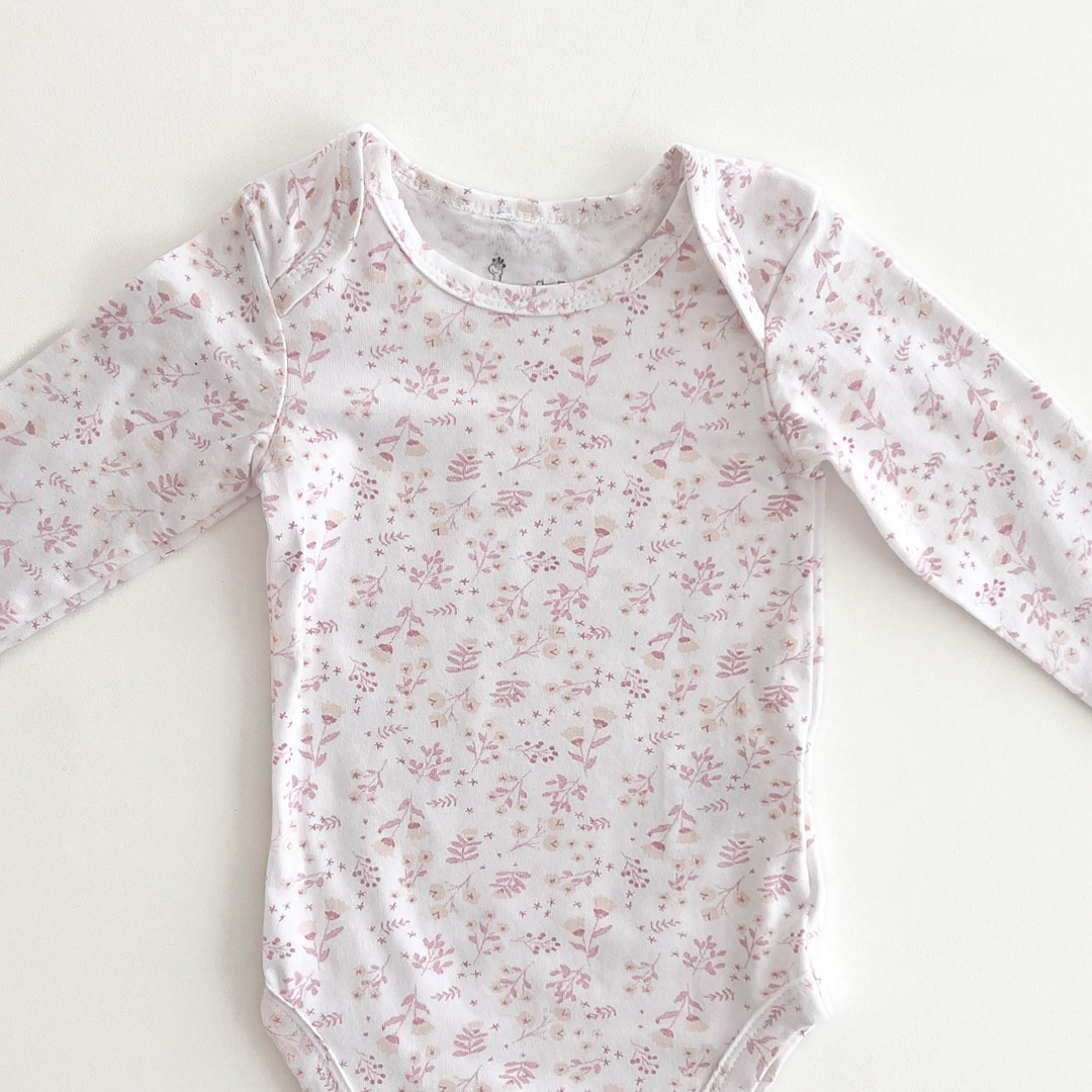 PINK FLORAL PATTERNED ONESIE