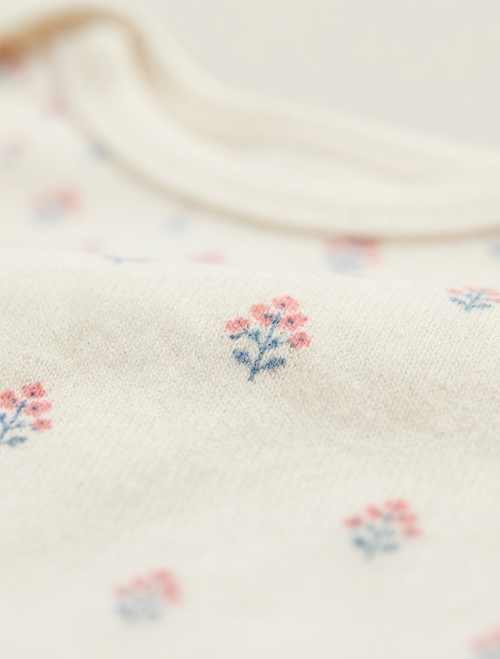 Off white floral printed onesie