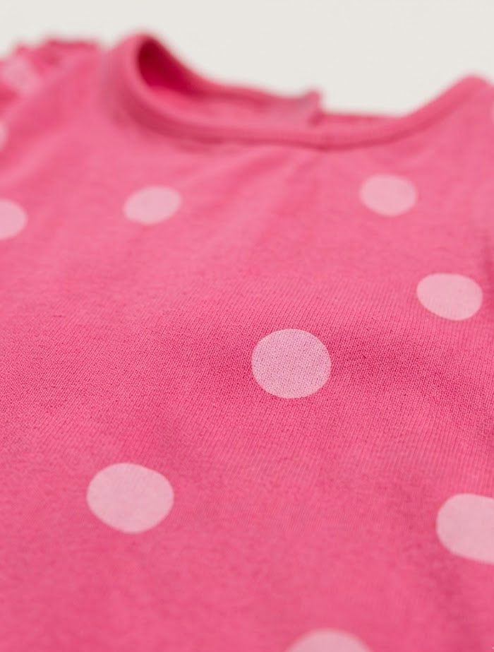 Pink polka dotted fancy onesie