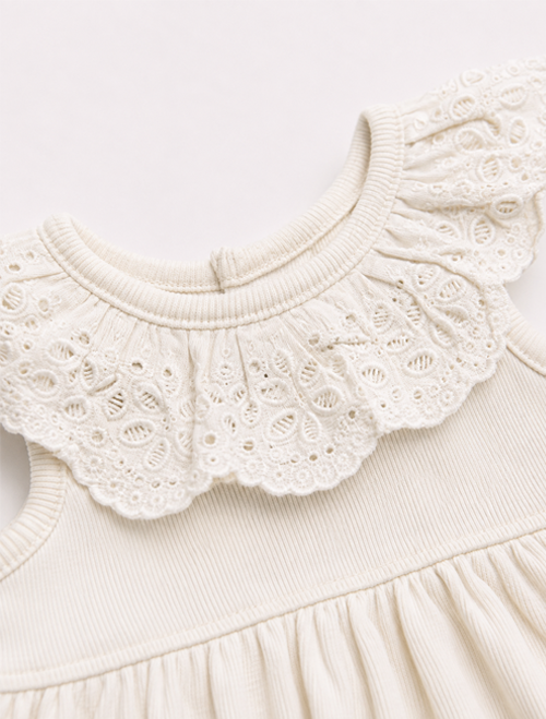 Off white ruffled onesie