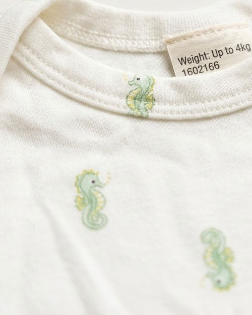 Green seahorses patterned onesie