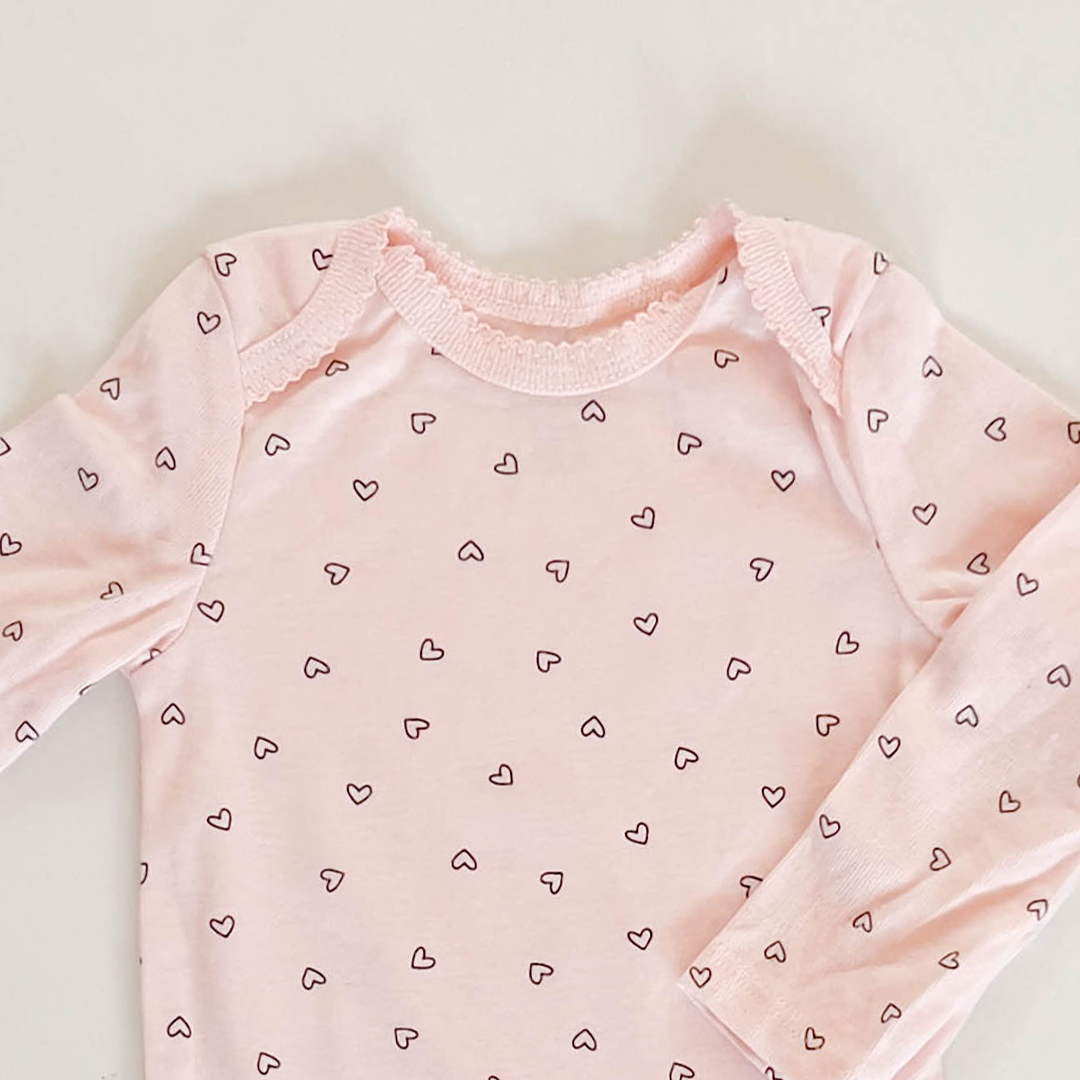 PEACH LOVE PATTERNED ONESIE