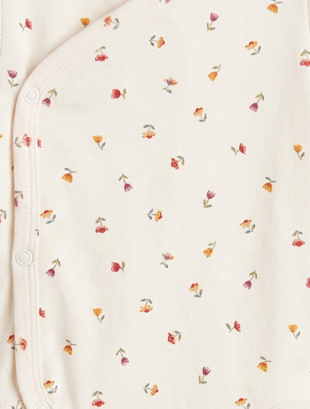 OFF WHITE WRAPOVER FLORAL ONESIE