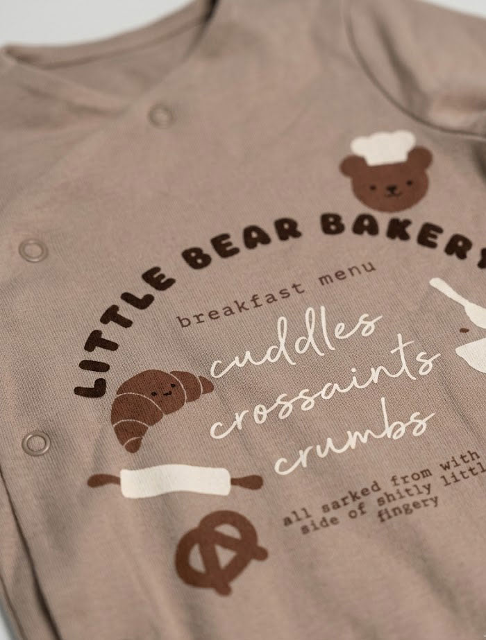 Light brown bakery wrap over sleep suit