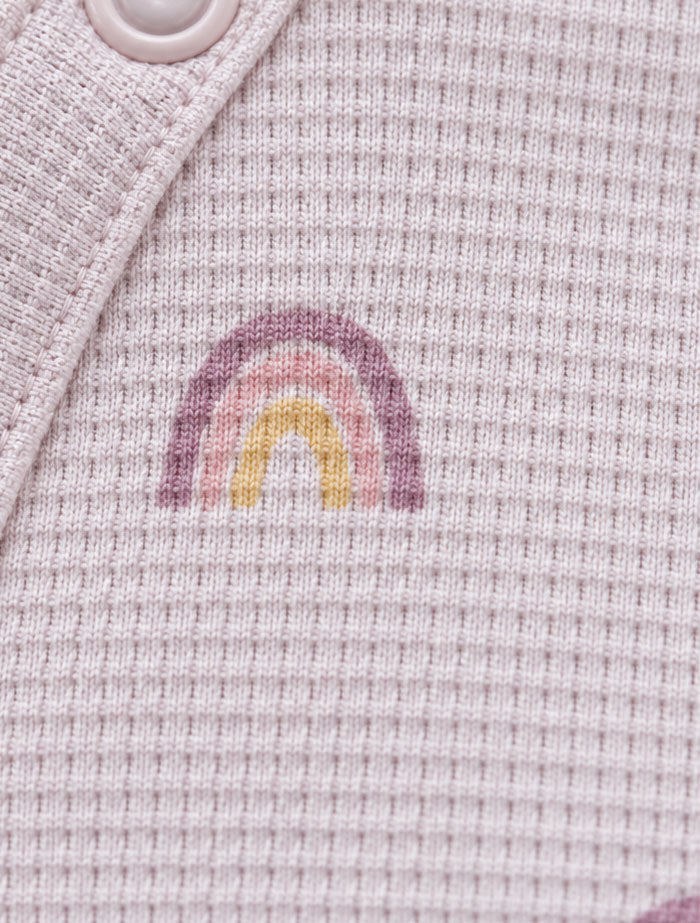 Dusty pink knitted rainbow sleep suit