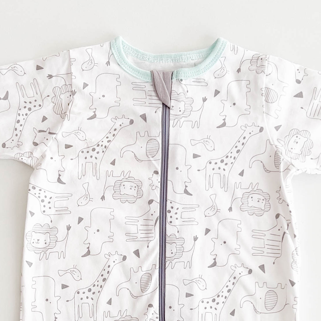 WHITE ANIMAL PRINTED SLEEPSUIT