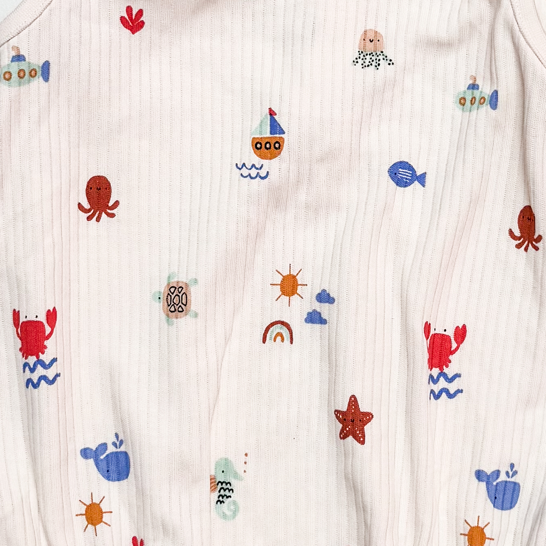 OFF WHITE RIBBED OCEAN ONESIE