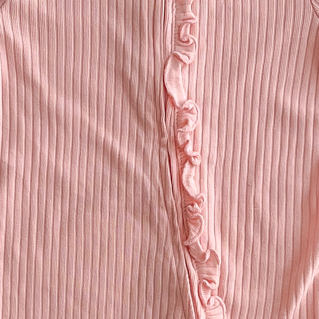 peach ribbed ruffles on front romper