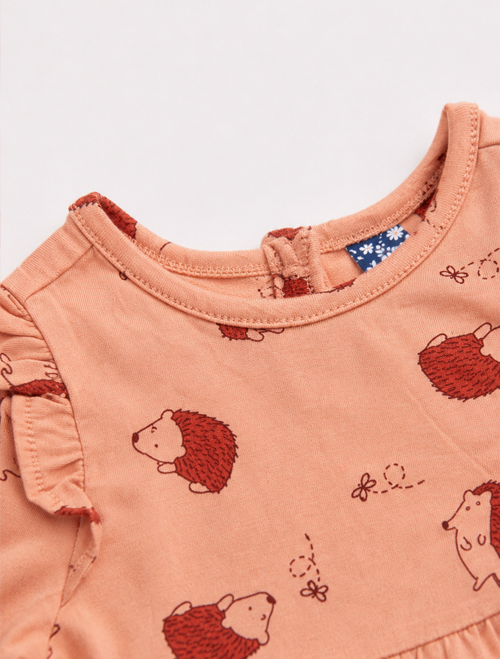ORANGE PRINTED RUFFLE ONESIE
