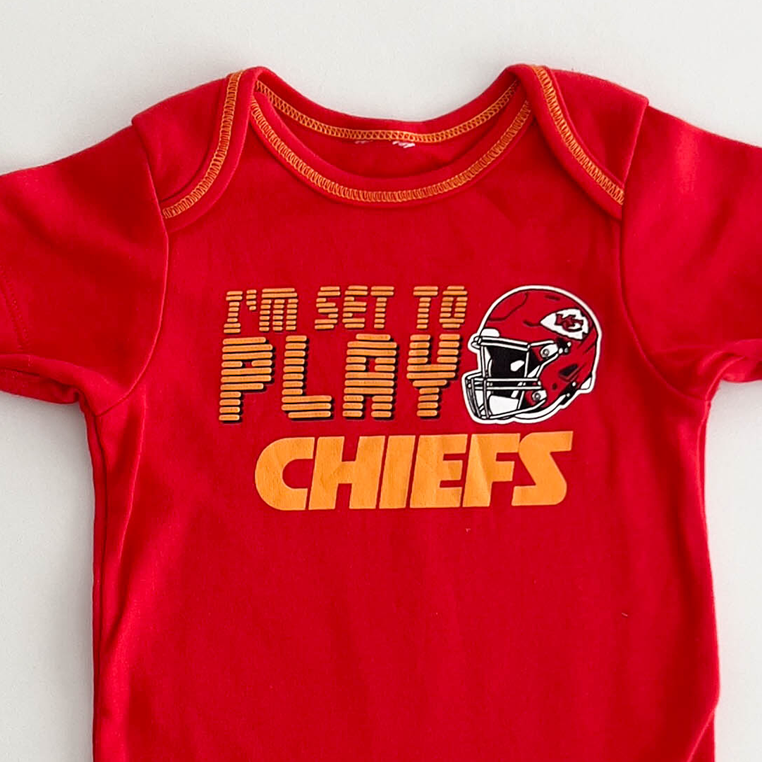 RED PRINTED COTTON ONESIE
