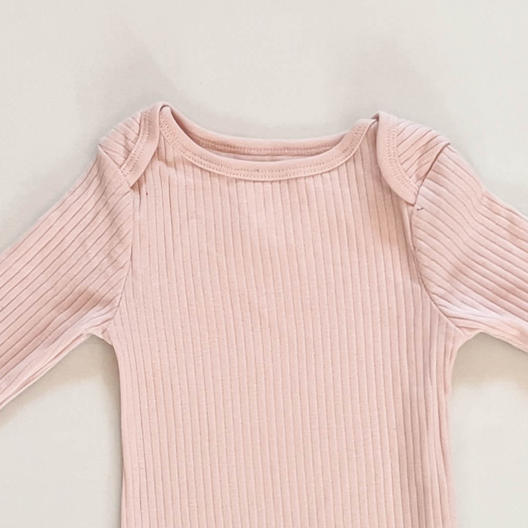 TENDER PEACH RIBBED ONESIE