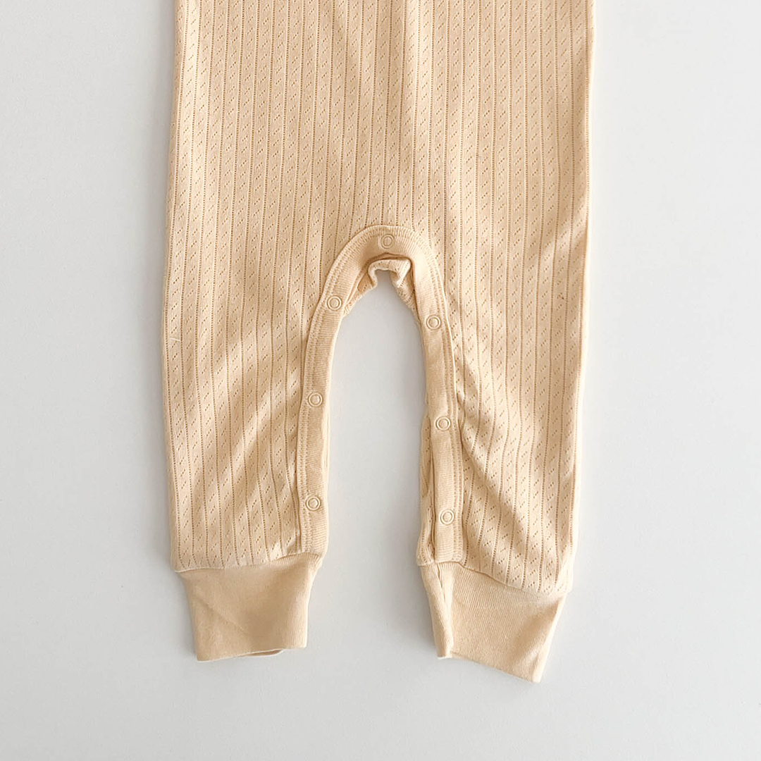 BUTTERMILK COLOURED POINTELLE ROMPER