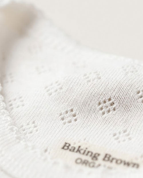 White pointelle full sleeve onesie