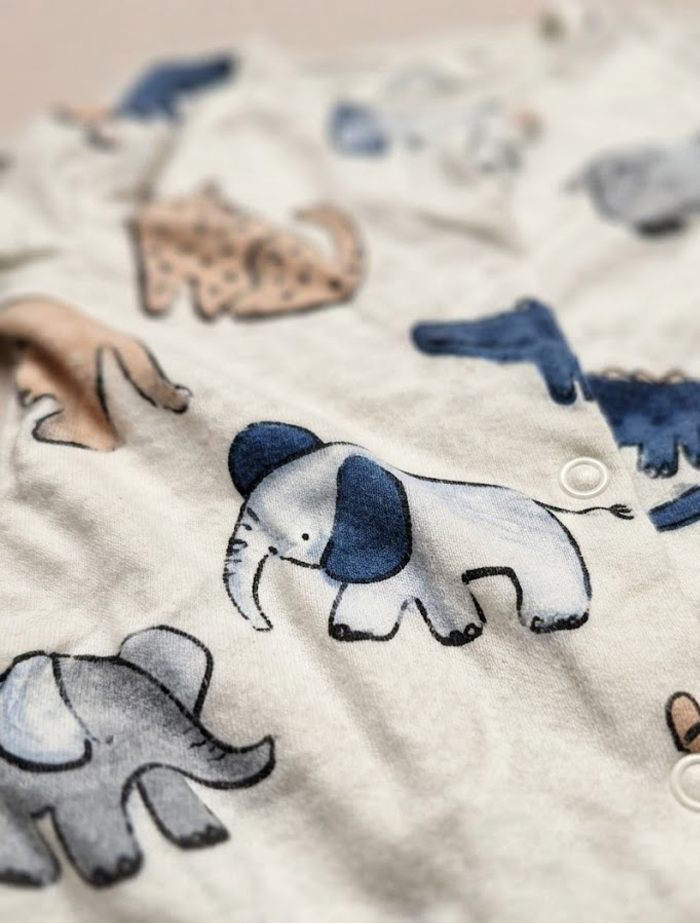 Cream animal printed sleepsuit