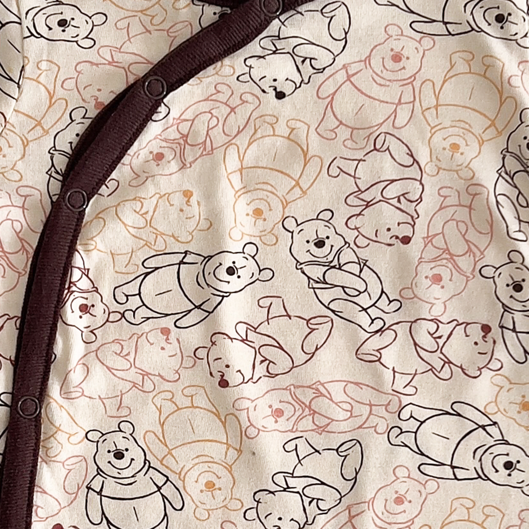 Beige and brown patterned sleepsuit