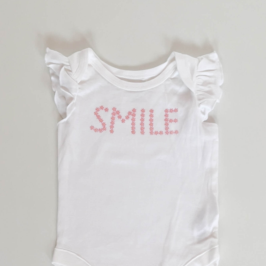 WHITE SMILE PRINT ONESIE