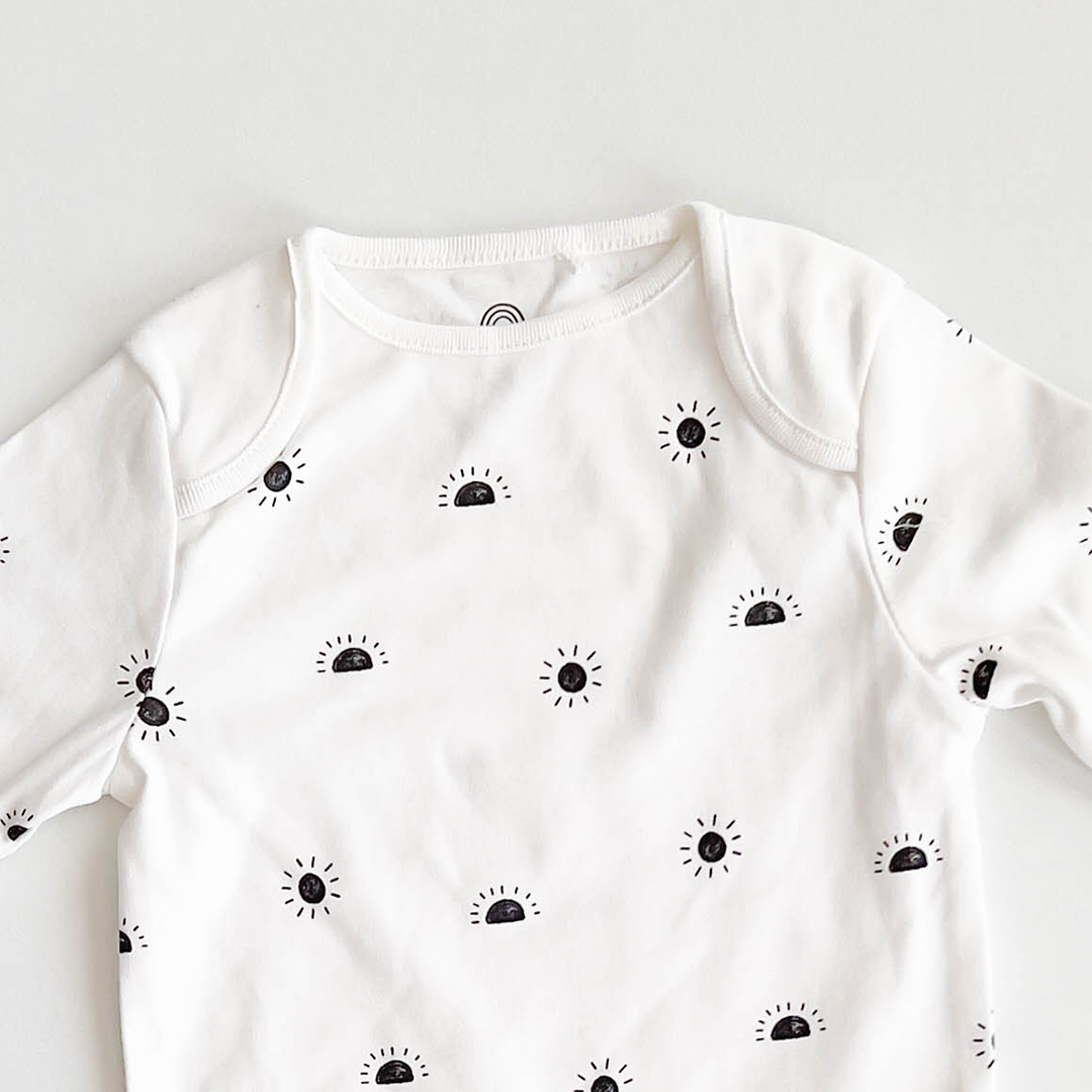BLACK SUN PRINTED ONESIE