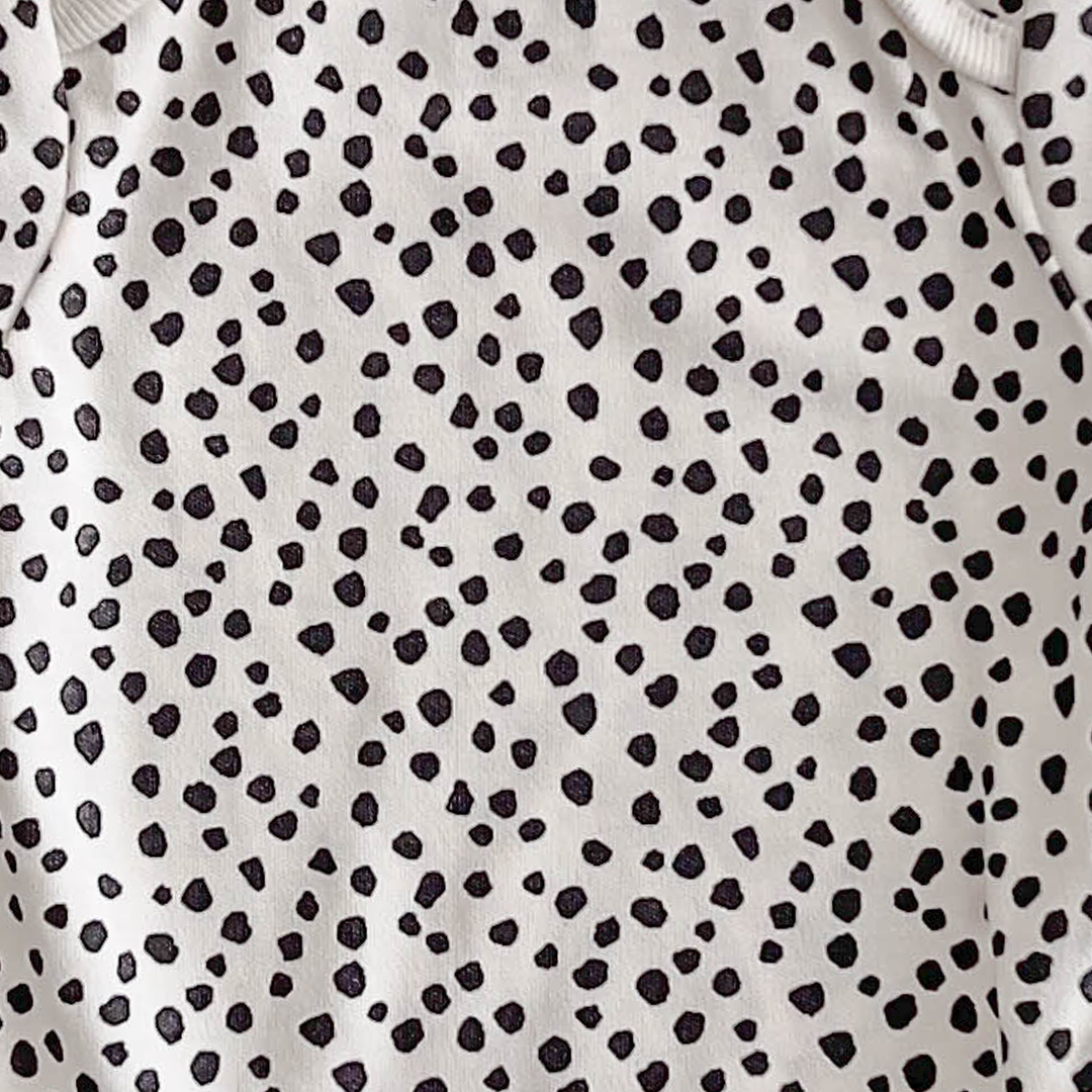 NEXT BABY BLACK AND WHITE PATTERNED ONESIE