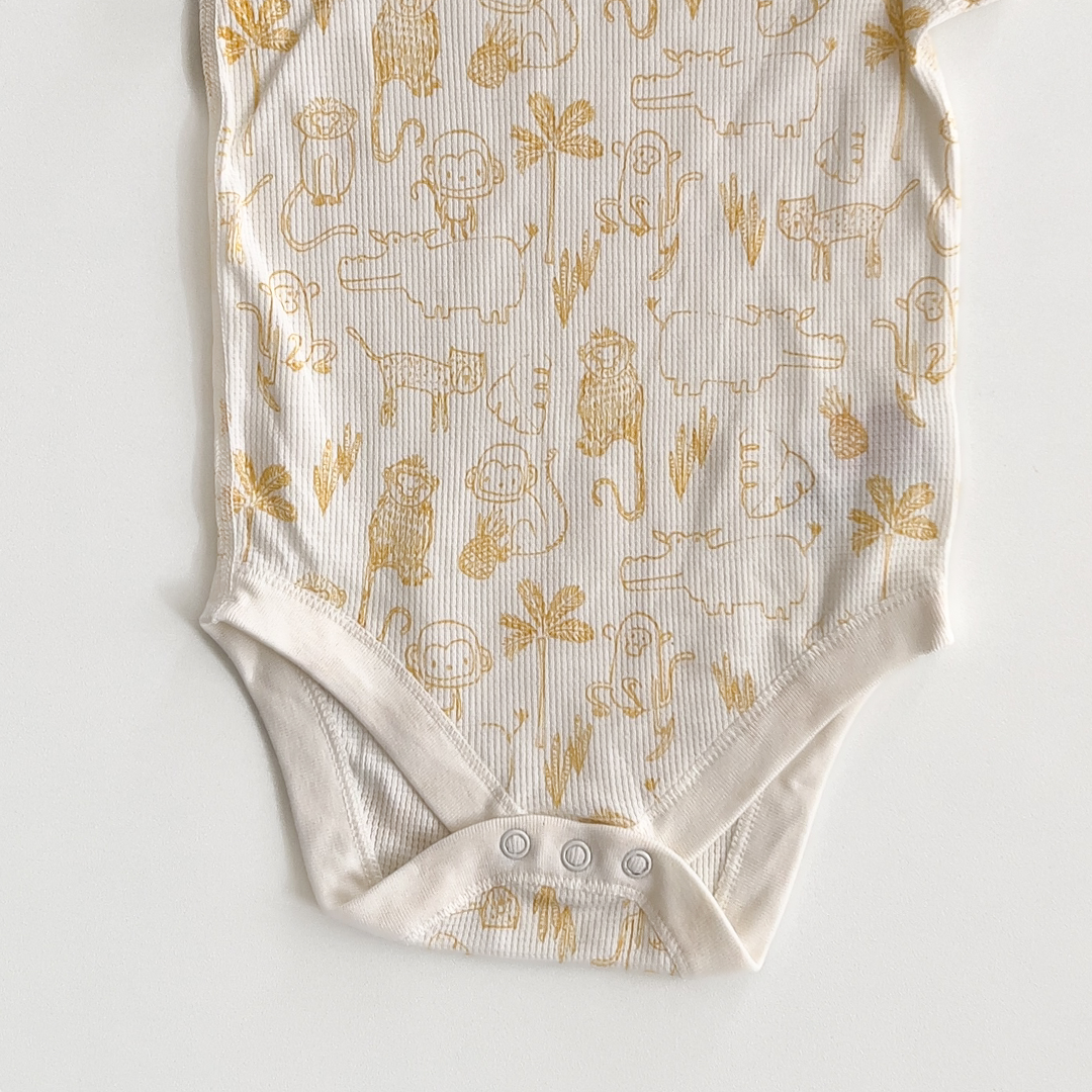 YELLOW ANIMAL PATTERNED ONESIE