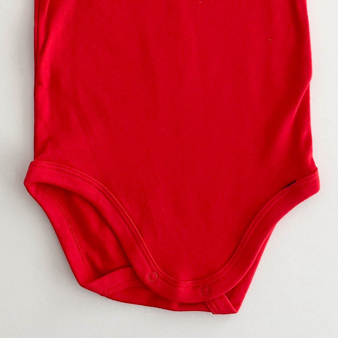 RED PRINTED COTTON ONESIE