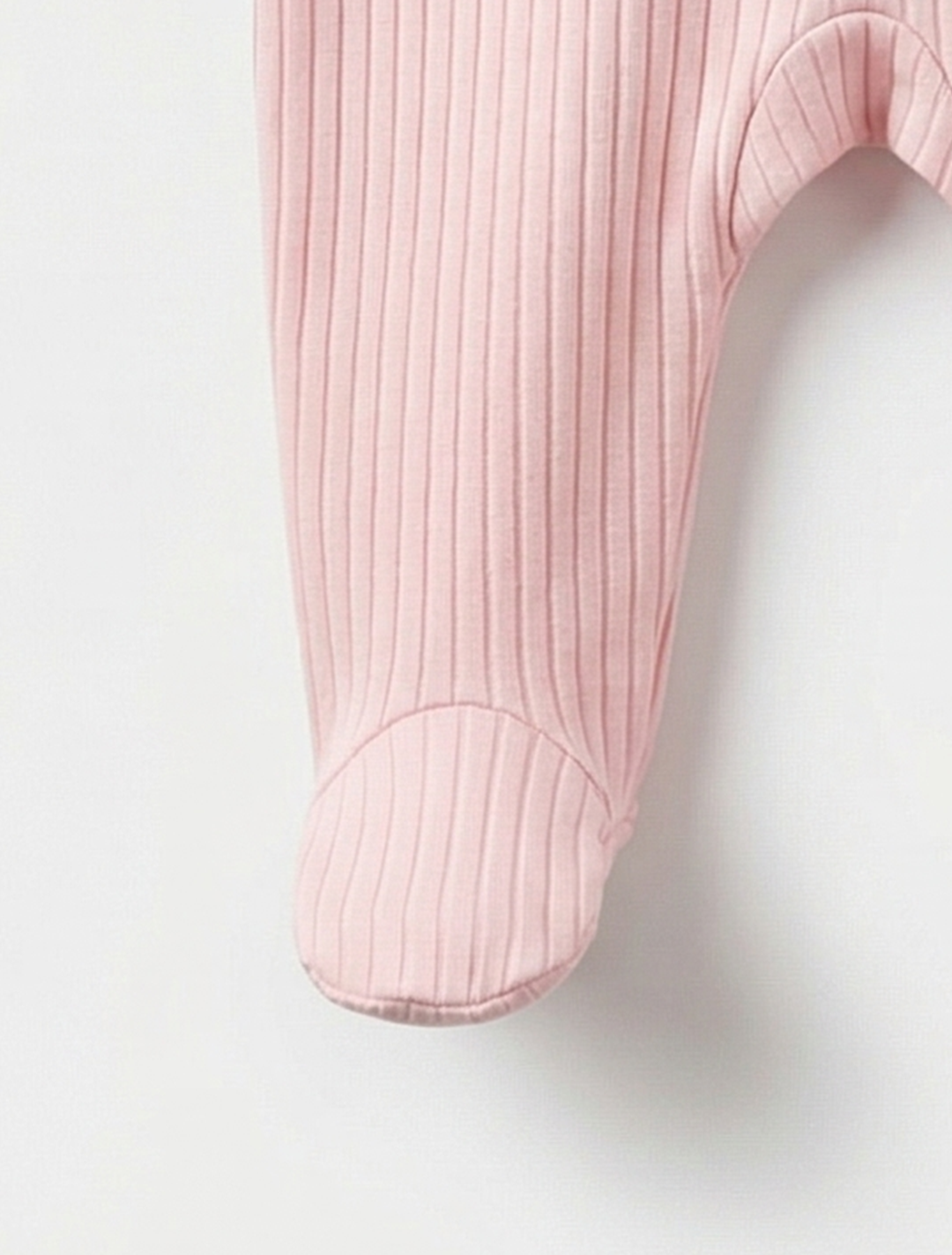 Pink ribbed sleepsuit